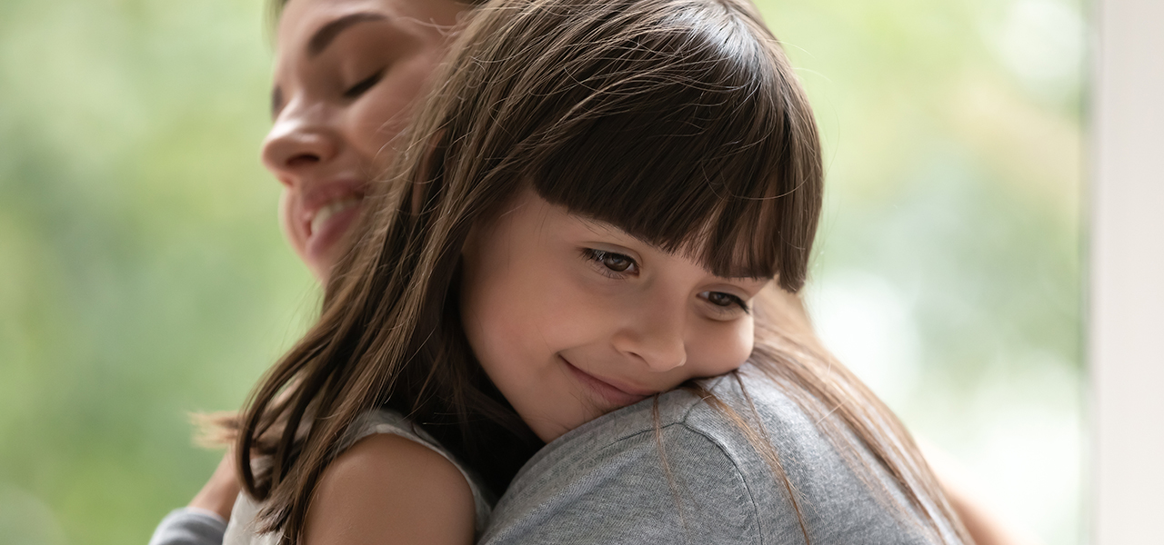 Mom and daughter hugging