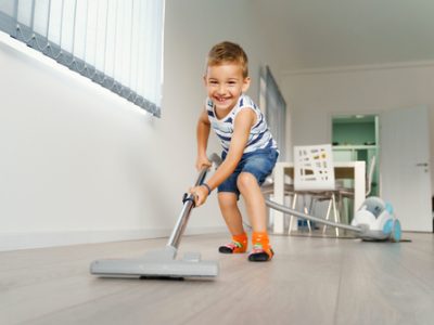 Little,Kid,Using,Vacuum,Cleaner,At,Home,-,Small,Boy