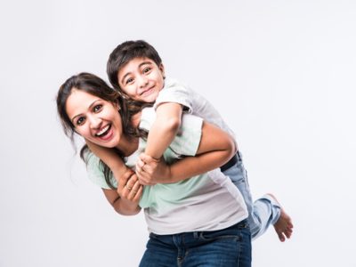 Portrait,Of,Indian,Young,Mother,And,Son,Against,White,Background,