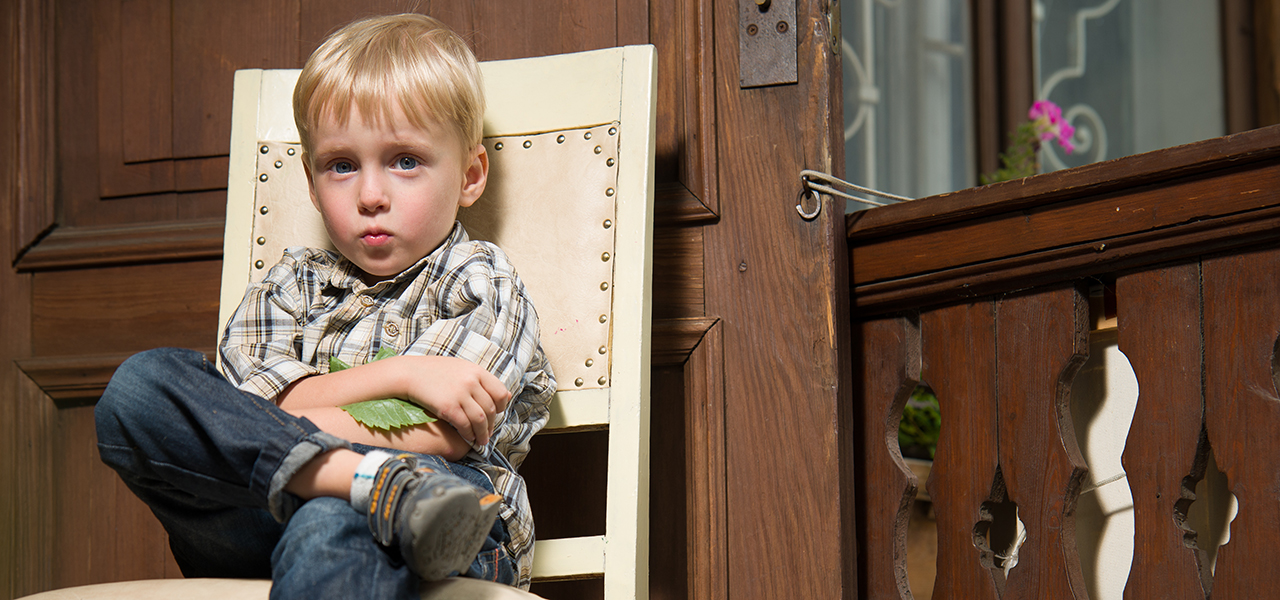 Little boy pouts in time out