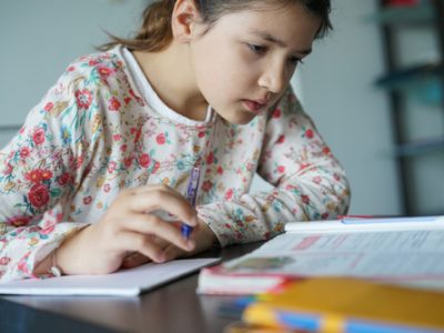 Young,Girl,Being,Busy,Doing,Homework