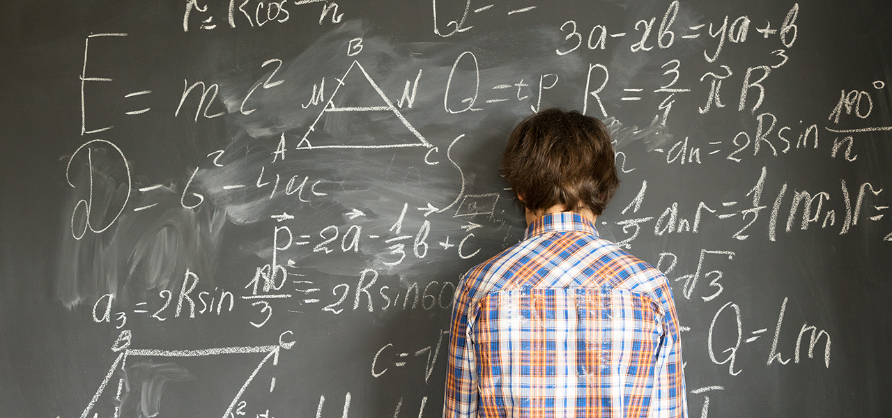 Boy gets bored and distracted trying to do math