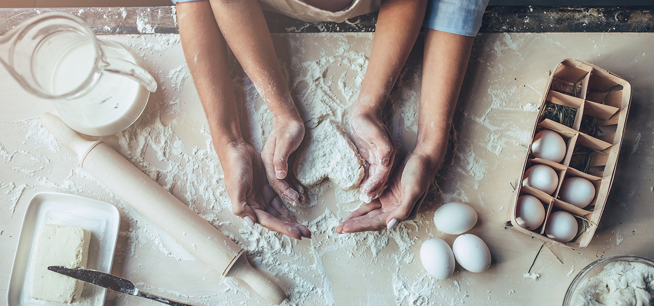 Parent and child baking together